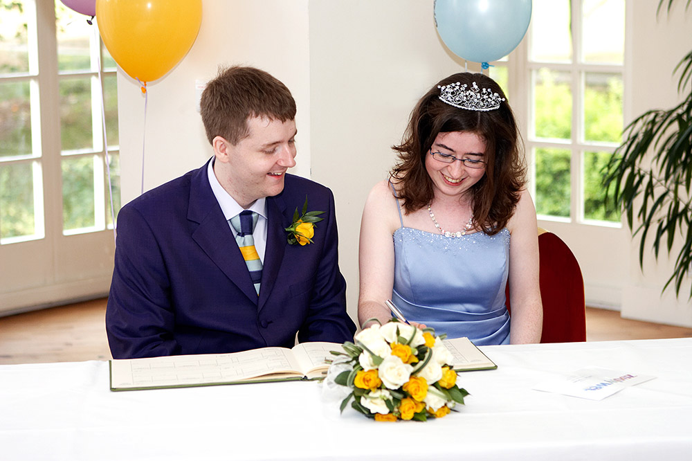 Paul and Edith signing the marriage register at their wedding ceremony in London Zoo on 3 September 2005