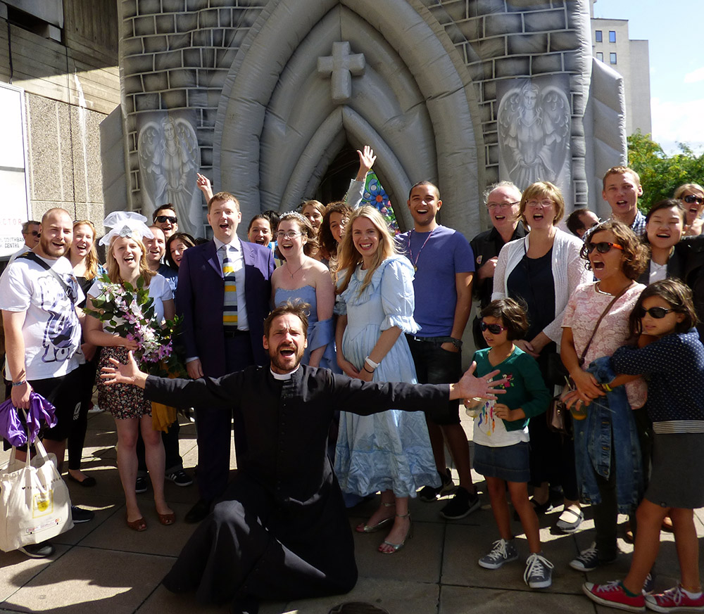 Paul and Edith with friends and strangers after a comedy wedding in an inflatable church at last year's Southbank Centre Big Wedding Weekend